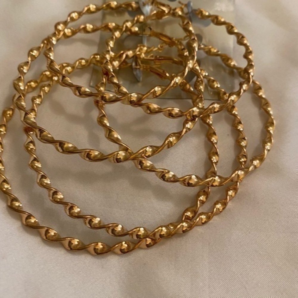 Three set of golden hoops earrings